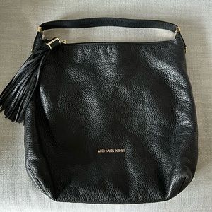 Lighlty used - also has a cross body option